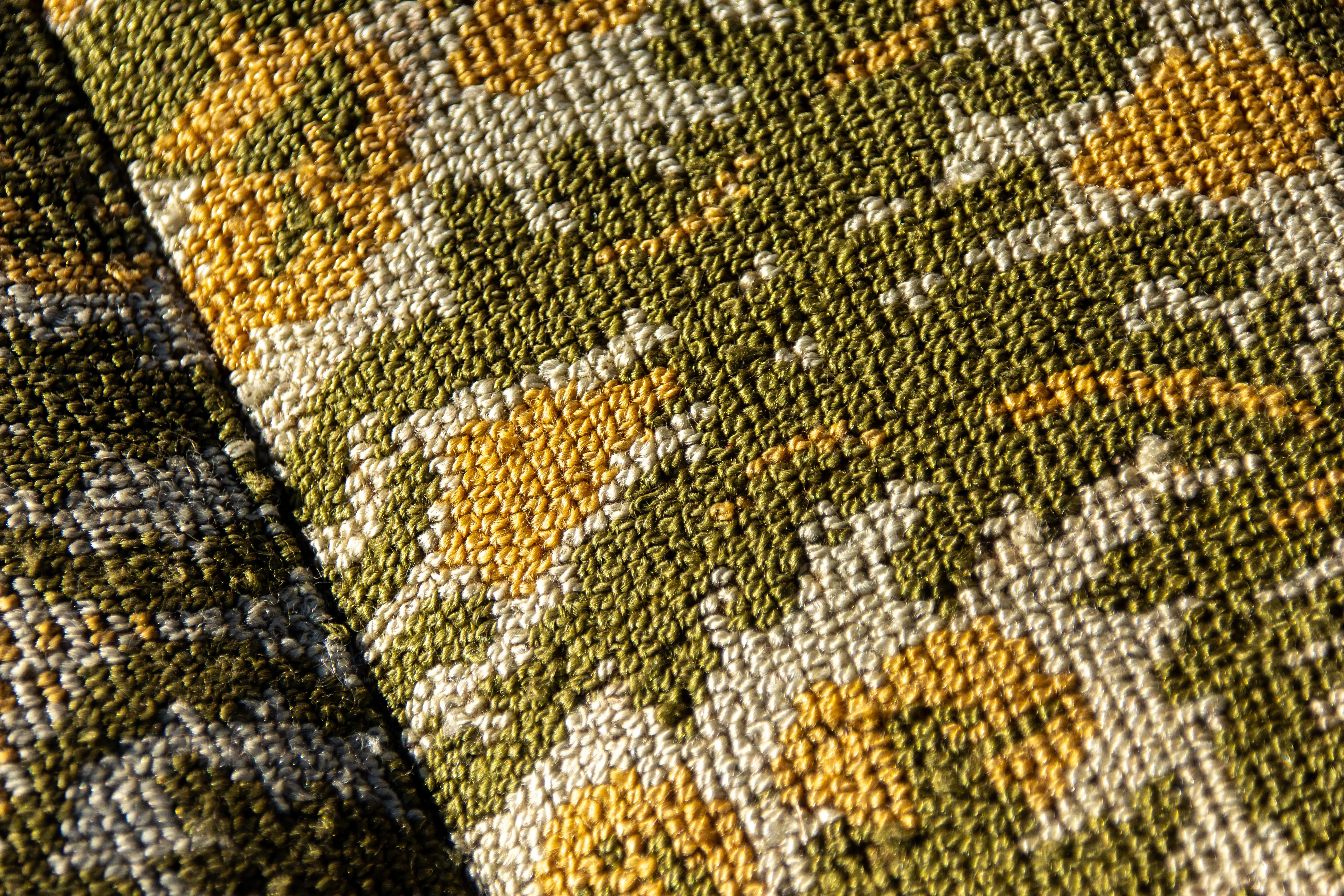 Detailed view of intricate floral pattern on textured woven fabric.