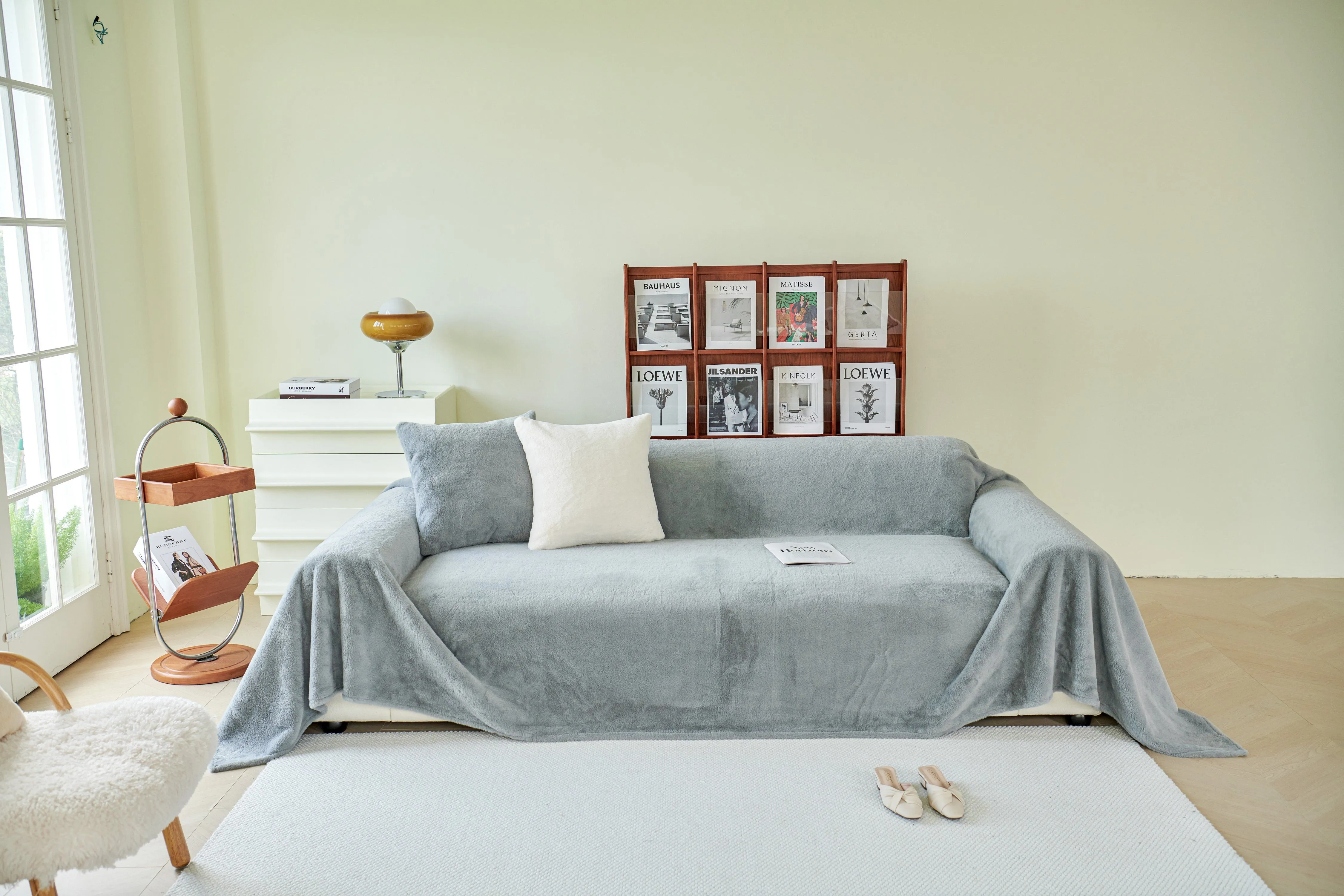 Elegant living room with a plush sofa, modern decor, and soft lighting for a cozy ambiance.