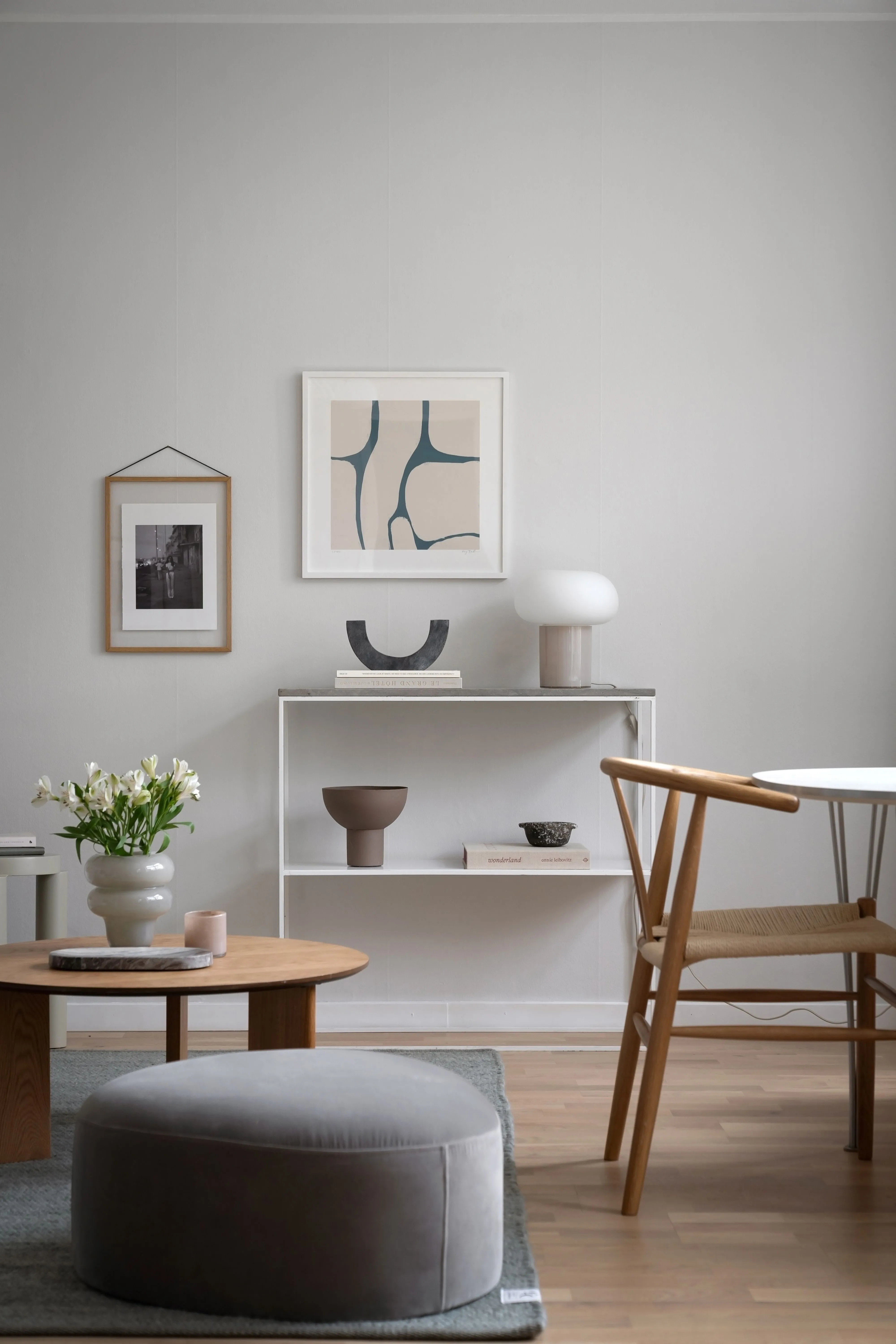 A stylish minimalist living room featuring contemporary furniture and elegant decor.