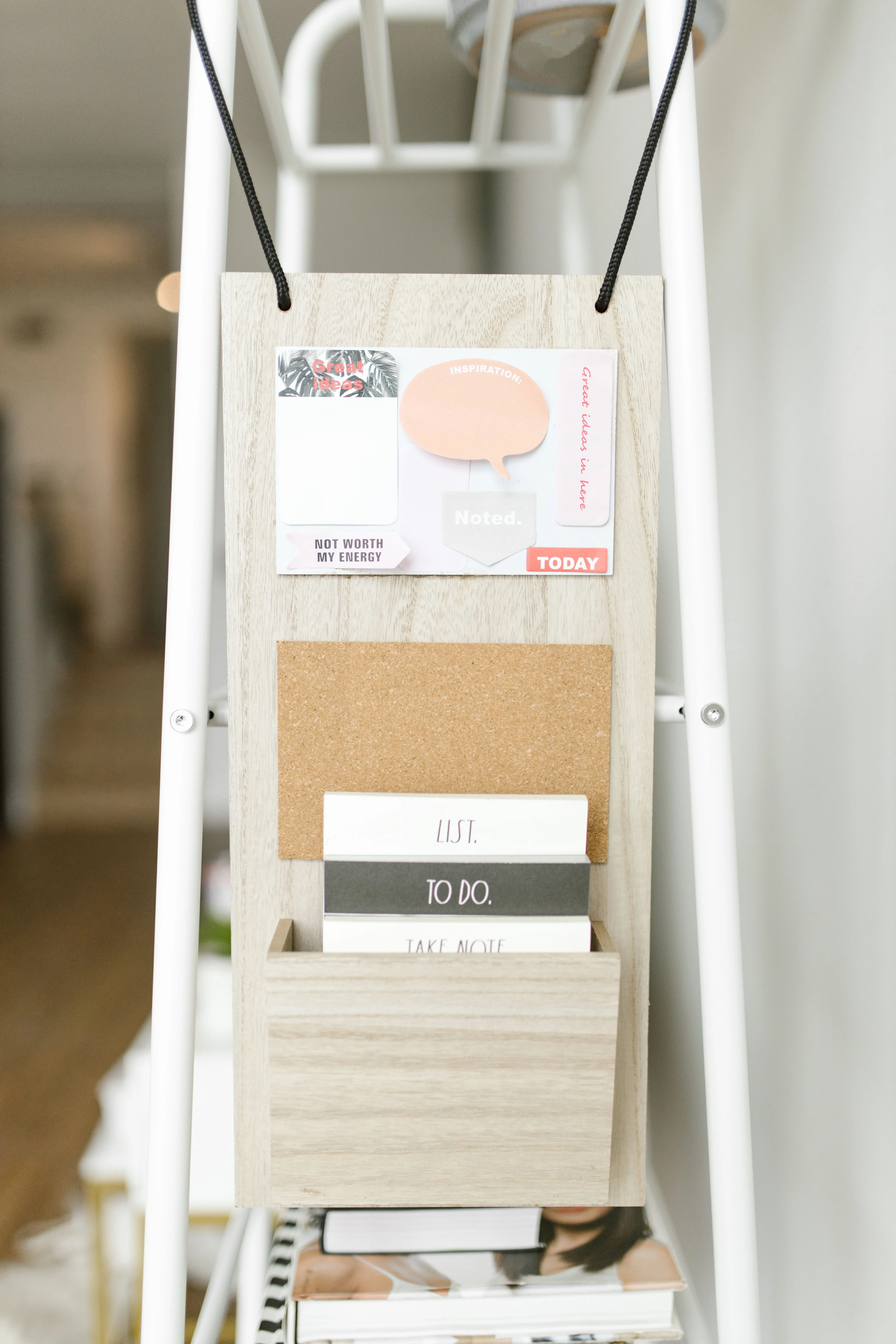 Close-up of a decorative wall organizer with cards and notepads. Perfect for organizing spaces.